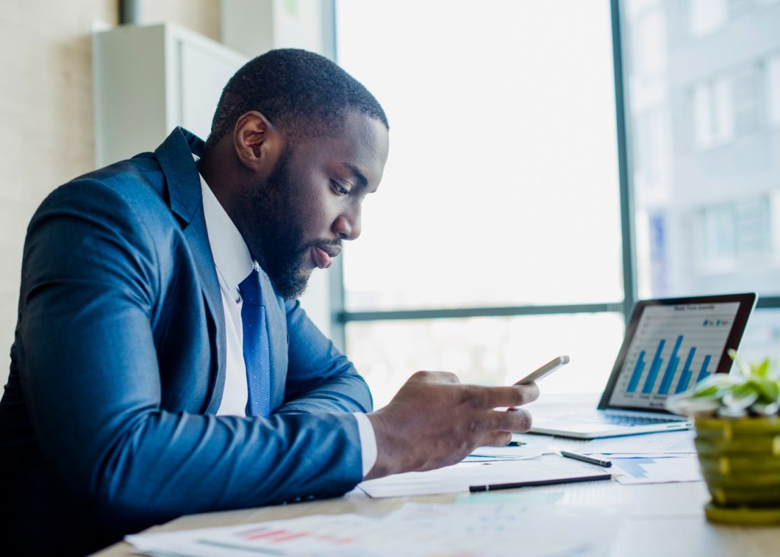 Businessman With Smartphone His Office