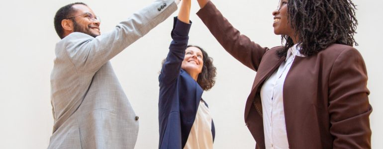 Happy Business Colleagues Enjoying Team Success (1)
