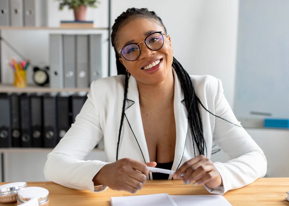 Medium Shot Smiley Woman Desk